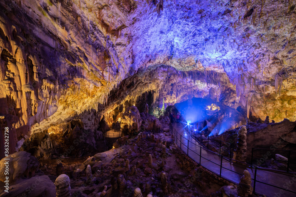 Postojna Cave in Slovenia iluminated with blue lighs