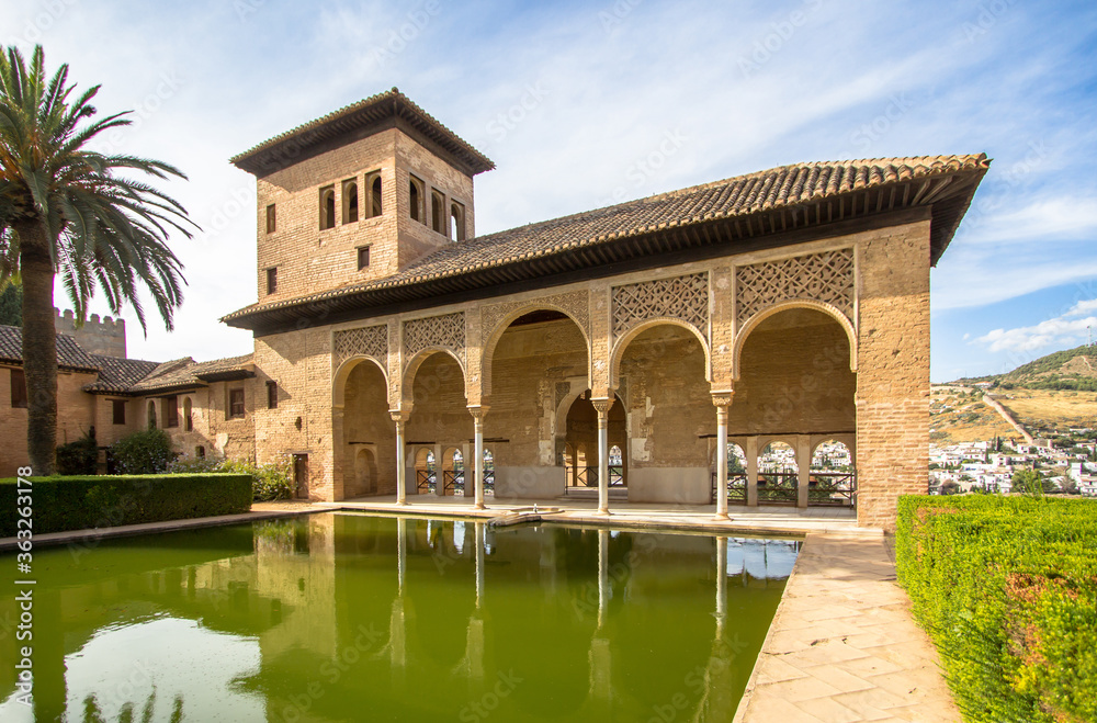Fototapeta premium Torre de las Damas in a garden of the Alhambra in Granada, Spain