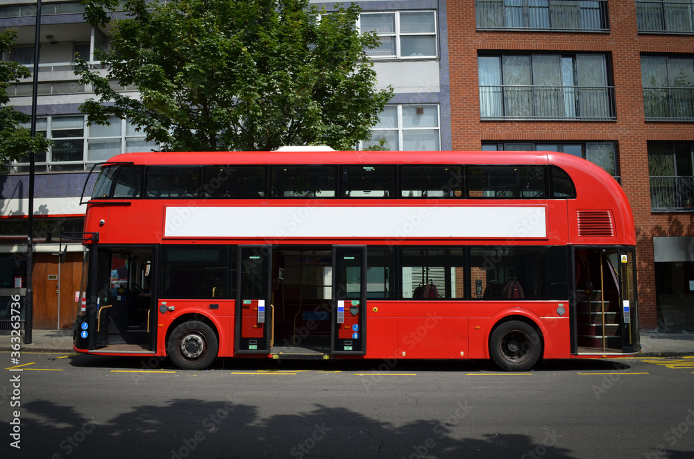 A modern London double-decker bus, spotted from the left side, with its doors open.