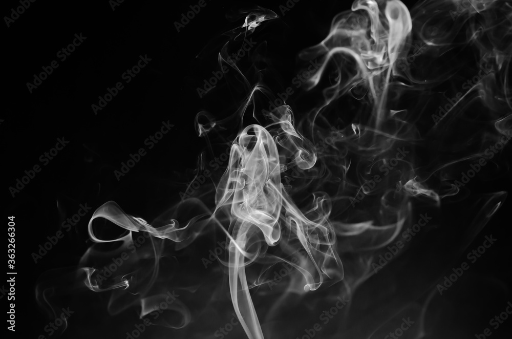 Fototapeta premium abstract fragment movement of white smoke on black background.