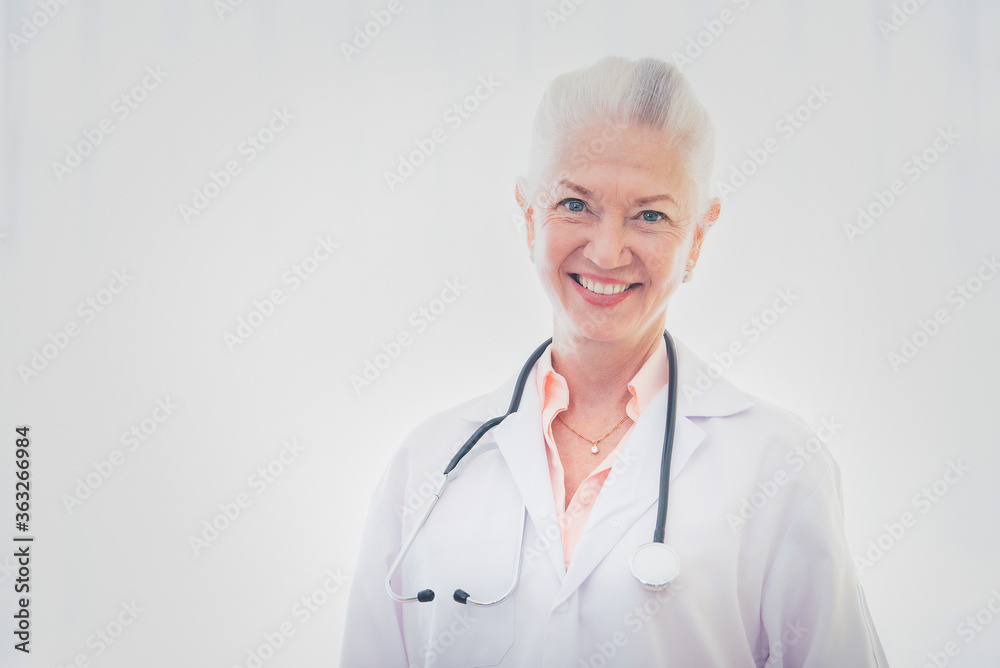 Portrait of senior woman doctor standing against white background. Portrait of senior woman doctor standing against white background.