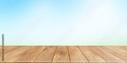 Empty wooden table with blurred backgound behind