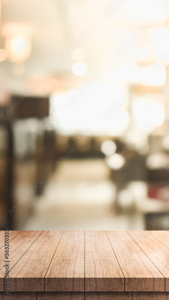 Empty wooden table top with lights bokeh on blur restaurant background Empty wooden table top with lights bokeh on blur restaurant background
