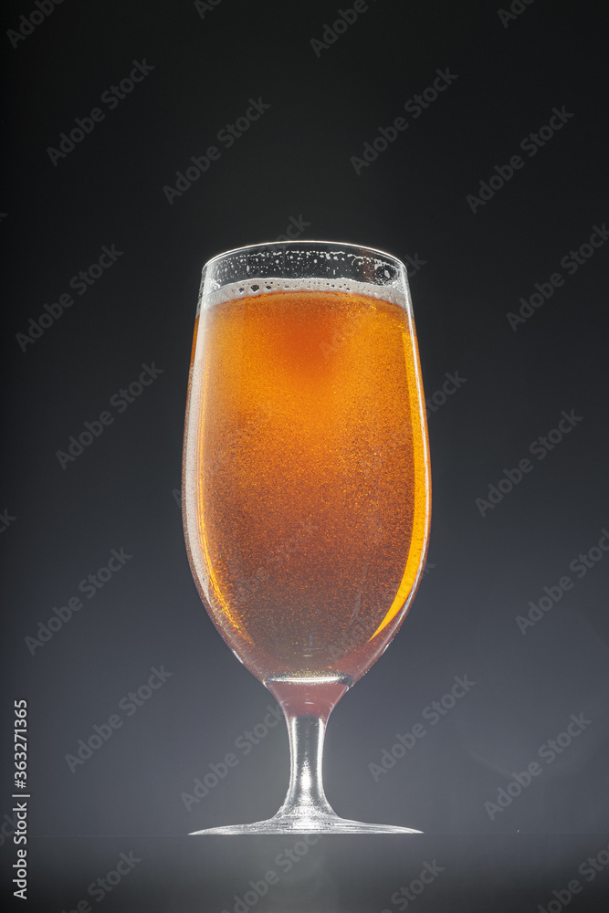 Glass of beer on black background, copy space Glass of beer on black background, copy space