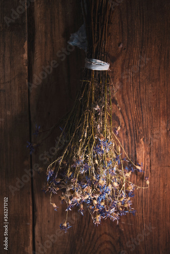 A bouquet of dry flowers on wooden background