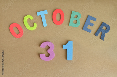 October 31, Toy alphabet with a brown background.