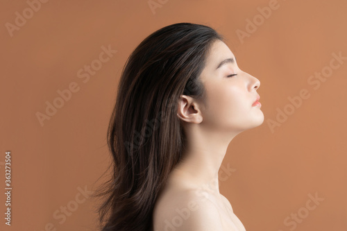 Beautiful asian woman with a beautiful face . Side view