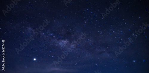 Panorama blue night sky milky way and star on dark background.Universe filled, nebula and galaxy.Many stars on dark night with noise , White clouds obscured and disturbed.