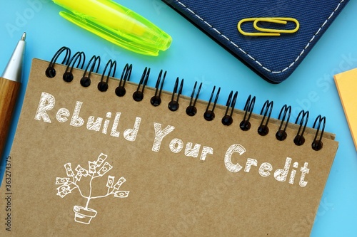 Financial concept about Rebuild Your Credit with sign on the piece of paper.