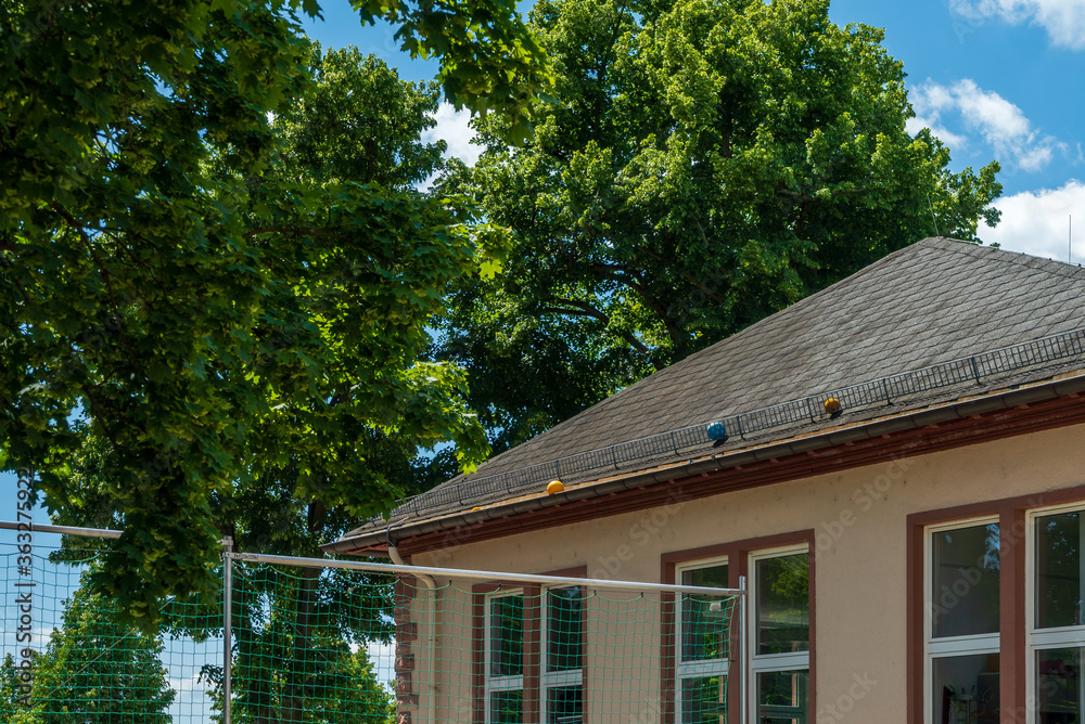 Lost colorful balls on a school roof