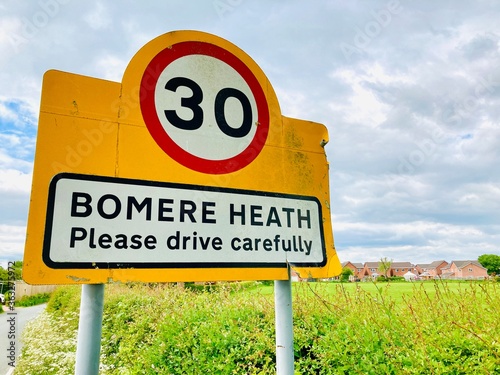 Road sign showing Bomere Heath in Shropshire with 30mph speed limit into the village photo