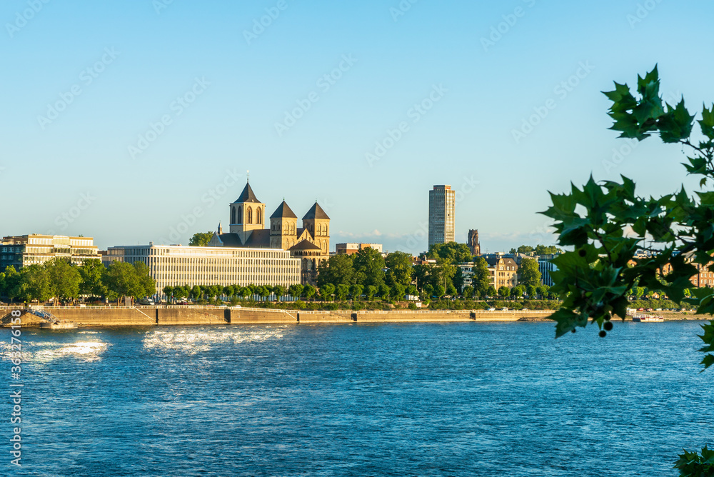 Fototapeta premium Catholic church Stankt Kunibert and the institute of the German economy in Cologne on the Rhine in the morning light
