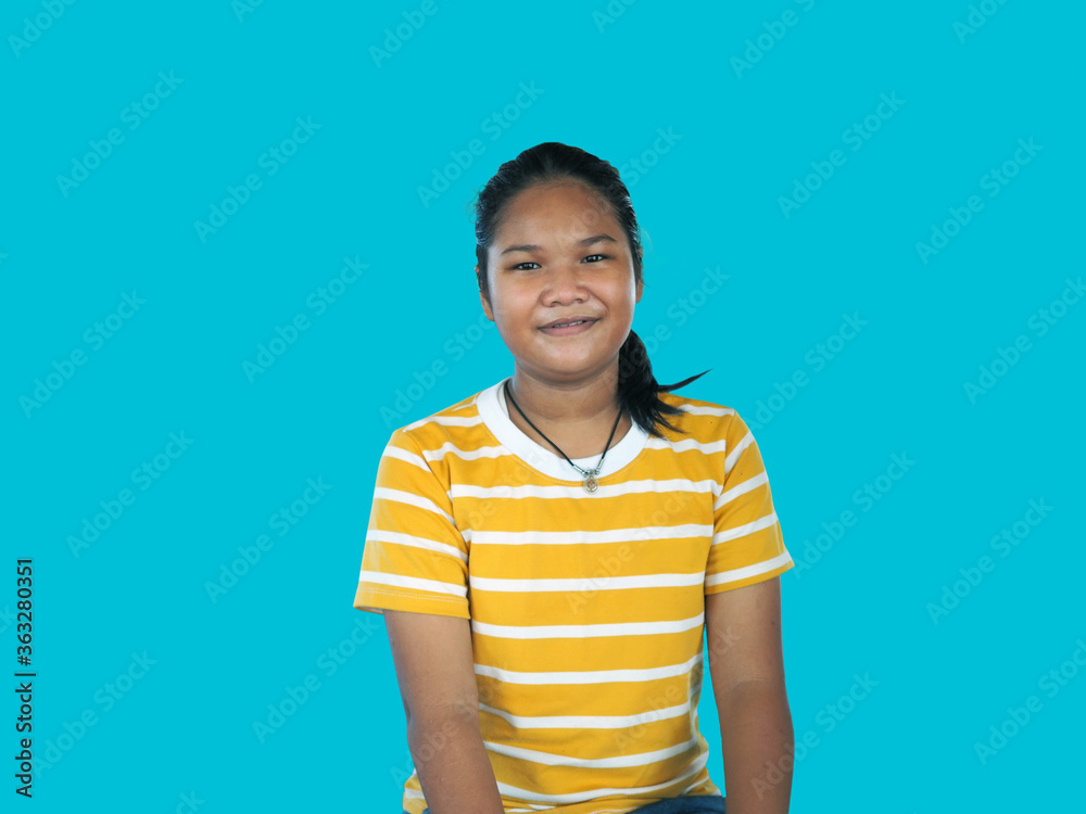 Portrait of Asian woman In a yellow shirt isolated on a blue background Portrait of Asian woman In a yellow shirt isolated on a blue background