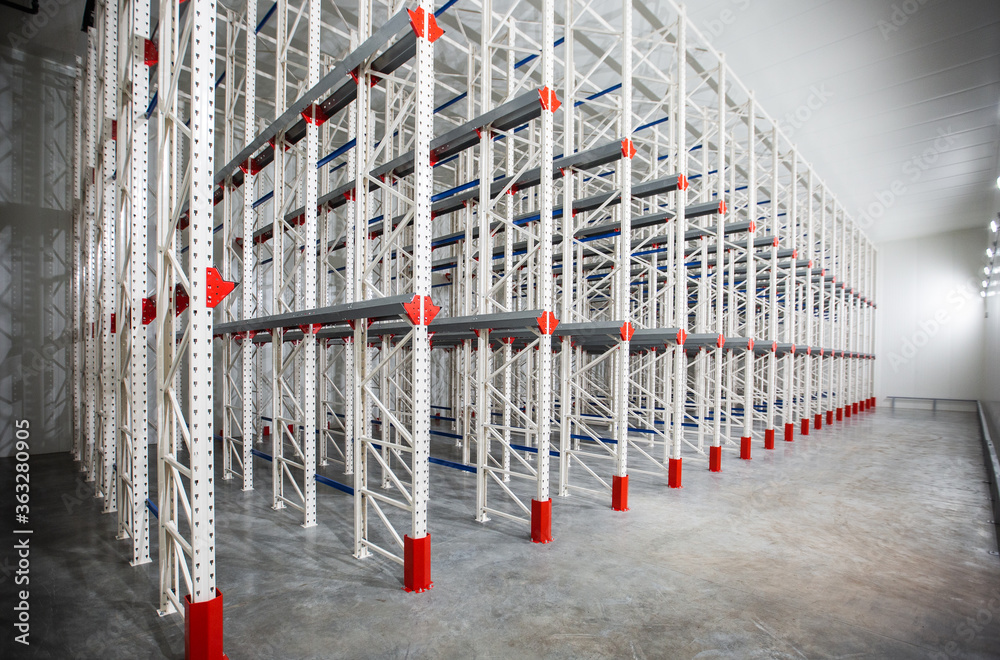 Warehouse Cantilever Racking Systems for storage Aluminum Pipe or profiles. Pallet Rack and Industrial Warehouse Racking. Steel profiles. Interior of Empty Big Huge Warehouse.