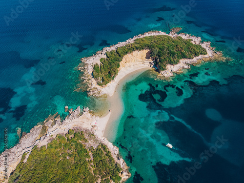 Aerial view of a beautiful deserted island in the turquoise sea. Drone shot.
