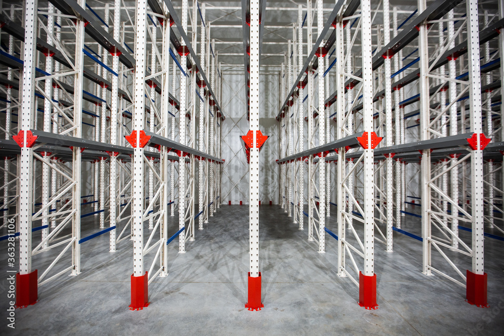 Warehouse Cantilever Racking Systems for storage Aluminum Pipe or profiles. Pallet Rack and Industrial Warehouse Racking. Steel profiles. Interior of Empty Big Huge Warehouse.