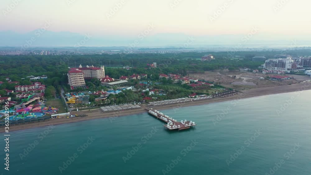 Coastline resort in Antalya, Turkey. Summer landscape at the resort city of Turkey on the Mediterranean sea coast. View from above. Coastline resort in Antalya, Turkey. Summer landscape at the resort city of Turkey on the Mediterranean sea coast. View from above.