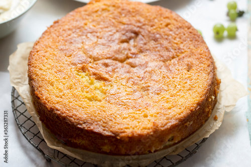 Sticky gooseberry saffron cake with vanilla custard
