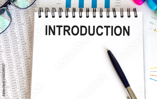 Word Introduction written on paper and a pen