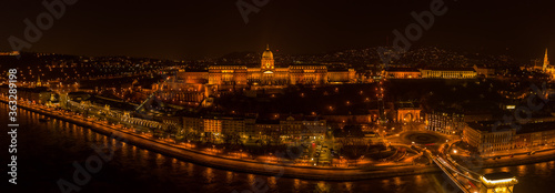 Panoramic aerial drone shot of Buda castle on Buda Hill in Budapest night with city lights on