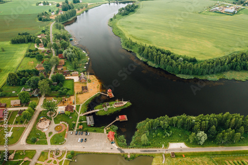 view from the height of the Lake in a green field in the form of a horseshoe and a village in the Mogilev region.Belarus.The Nature Of Belarus photo