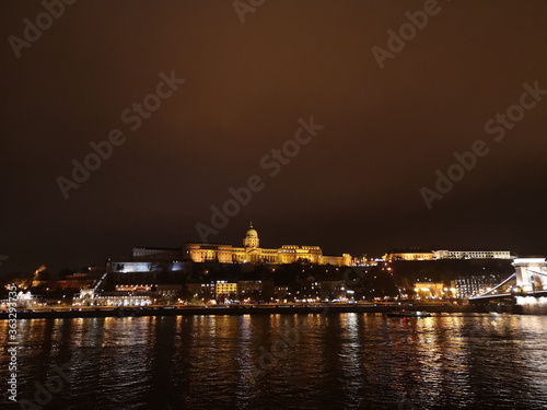 Budapest Royal Castle and Szechenyi Chain Bridge at day time from Danube river  Hungary.  