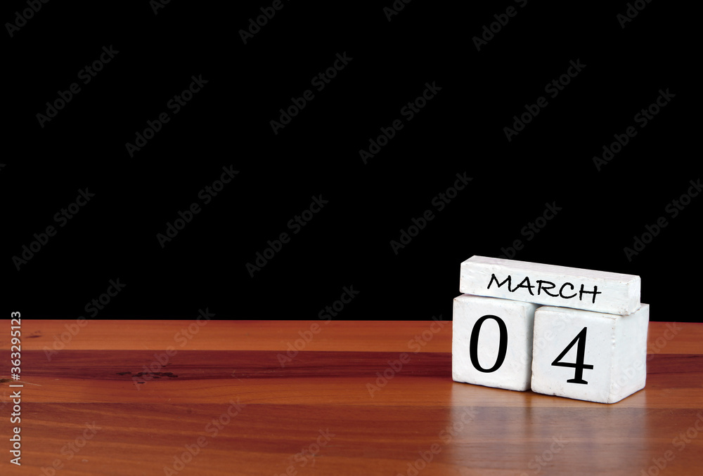 4 March calendar month. 4 days of the month. Reflected calendar on wooden floor with black background 4 March calendar month. 4 days of the month. Reflected calendar on wooden floor with black background