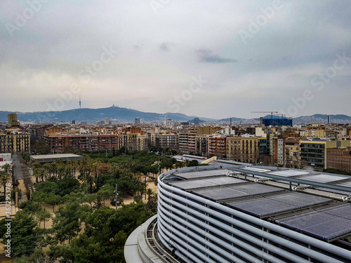 Photography View over old town city barcelona park sand trees with cranes and construction b