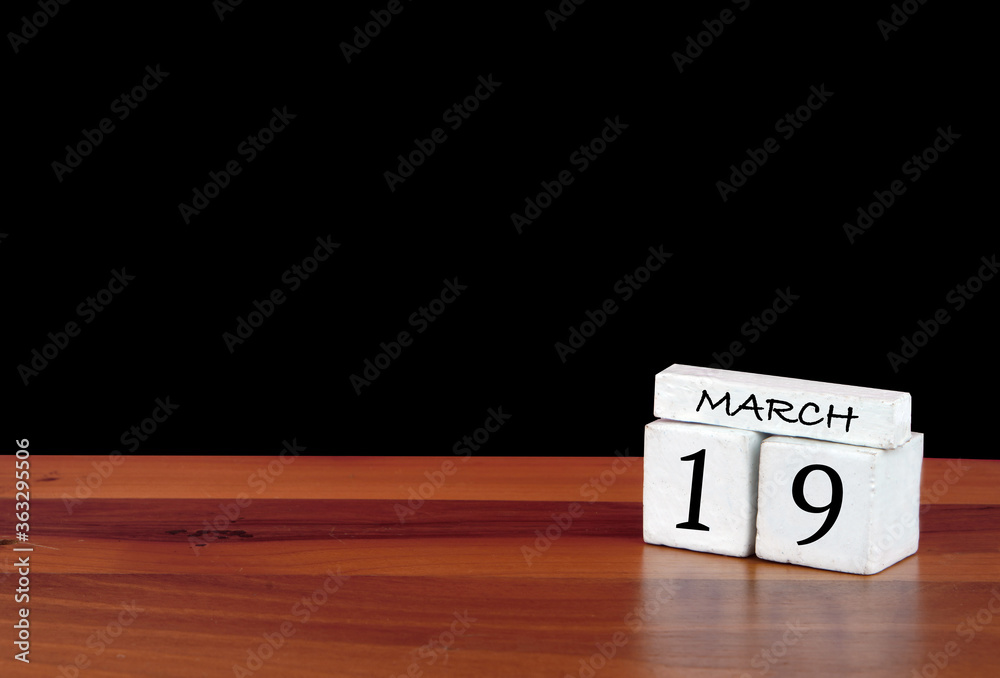 19 March calendar month. 19 days of the month. Reflected calendar on wooden floor with black background 19 March calendar month. 19 days of the month. Reflected calendar on wooden floor with black background