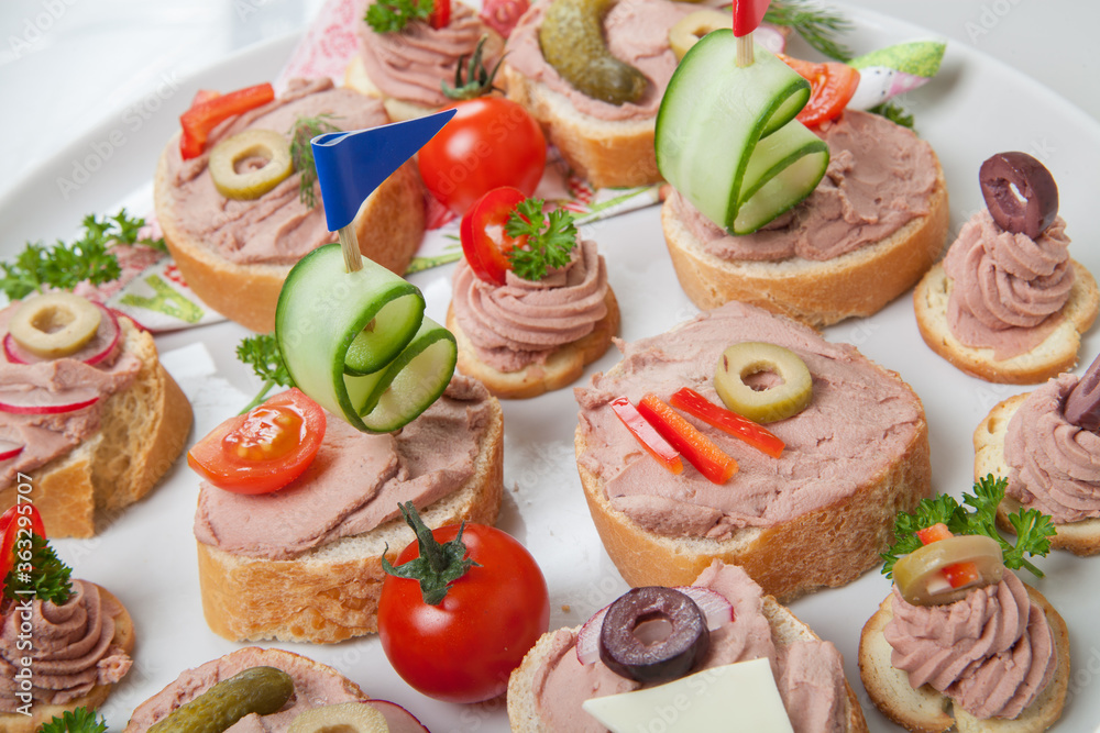 party platter with sandwiches with pate and vegetables party platter with sandwiches with pate and vegetables