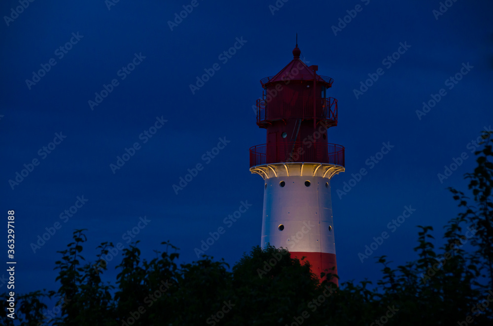 A small and beautiful lighthouse iat night in Falshöft, Germany
