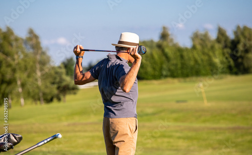 A player warming up before playing golf