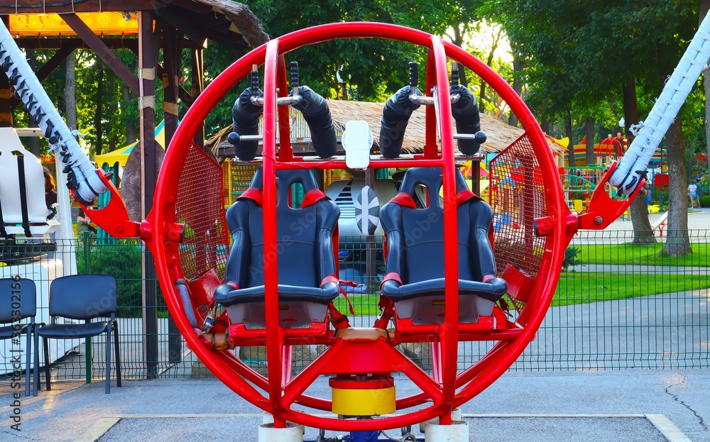 Extreme attraction in the park red round catapult close-up Extreme attraction in the park red round catapult close-up