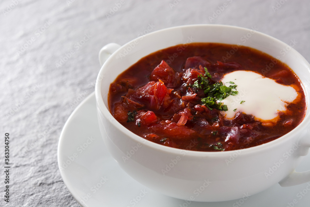 Traditional Ukrainian Russian borsch. Beetroot soup on gray background Traditional Ukrainian Russian borsch. Beetroot soup on gray background