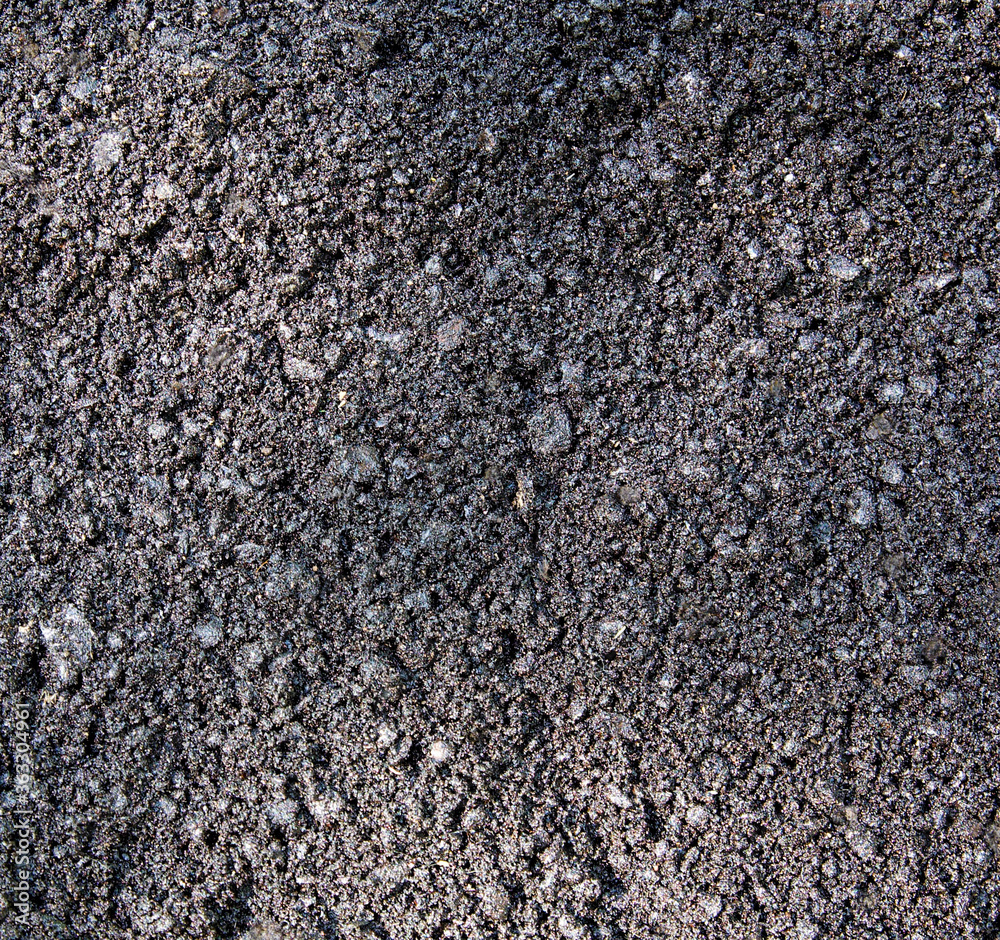 Texture of fresh raw asphalt closeup Texture of fresh raw asphalt closeup