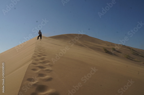 Woman hiker on a sand dune