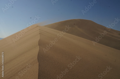 sand dunes and blue skies