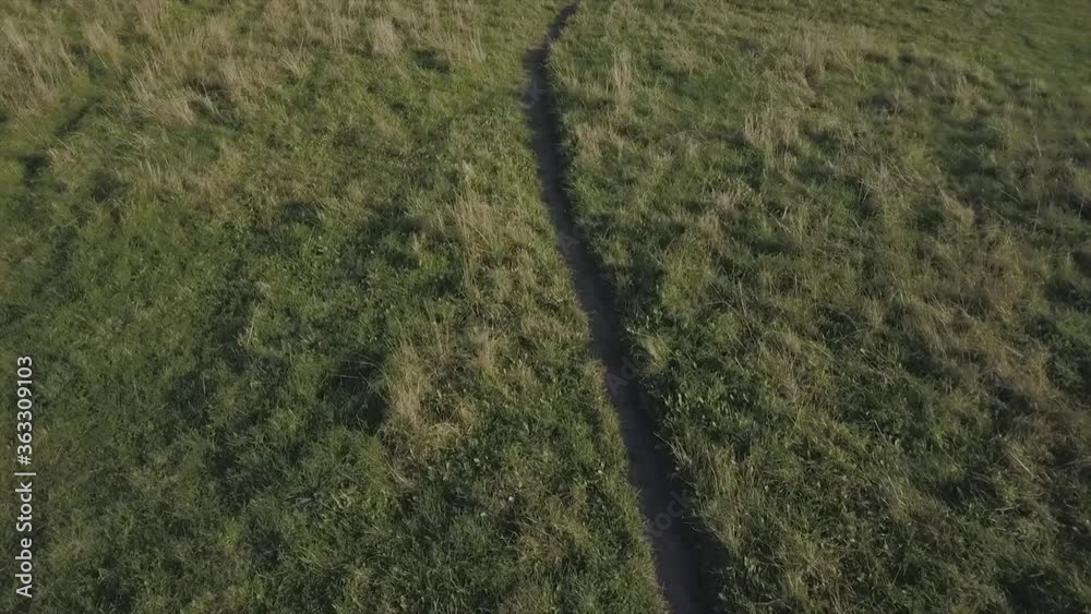 Aerial Beautiful Grass field and following Pathway on field Aerial Beautiful Grass field and following Pathway on field