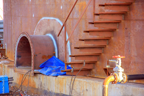 View of the clean out manhole of the oil storage tank with floating roof. This menhole heat treatment, magnetic testing, penetrant testing, radiography or ultrasonic required. photo