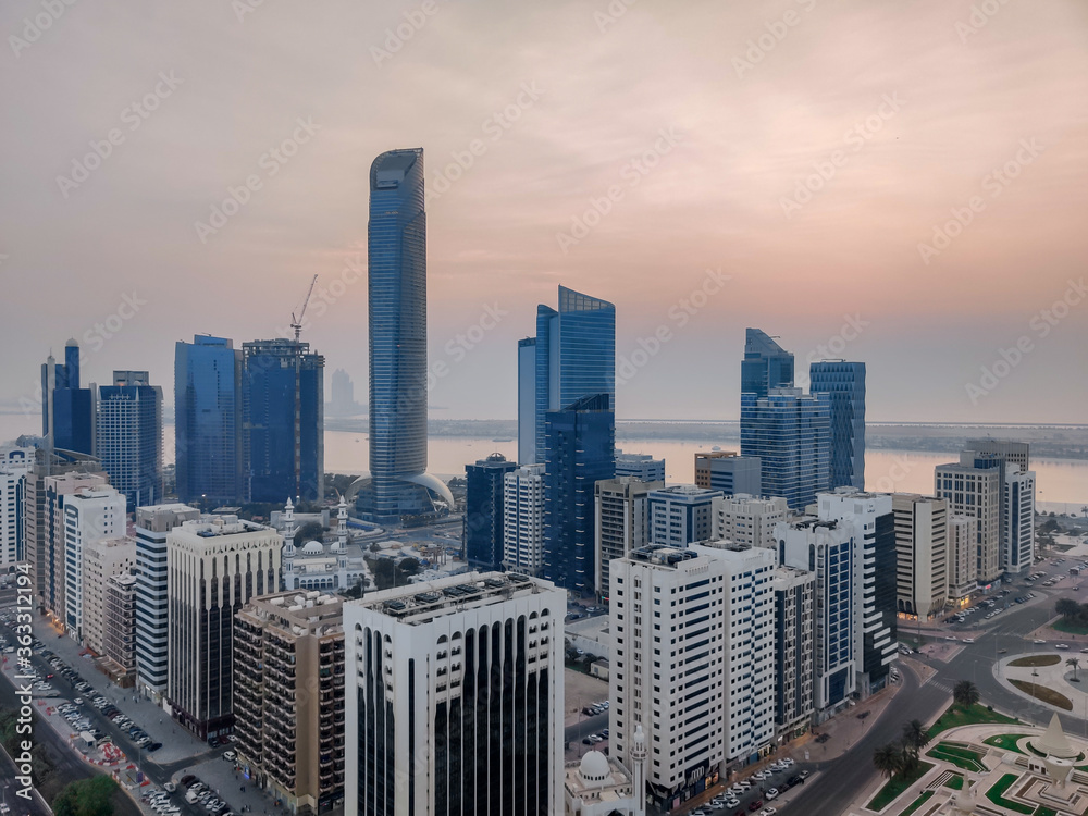 Incredible aerial view of Abu Dhabi city skyline and famous towers | Corniche skyscrapers