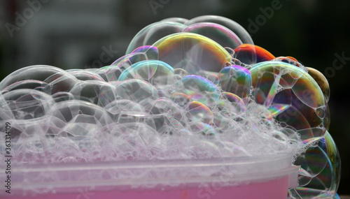 Bubble in water Isolated in black background. Rainbow style