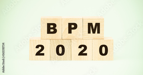 bpm 2020 inscription on wooden blocks business process management concept