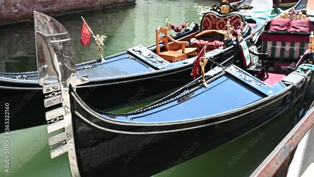Venice, Italy - gondolas and gondoliers in the Grand Canal near the Rialto Bridge, in the San Marco Basin and between the canals of the lagoon city