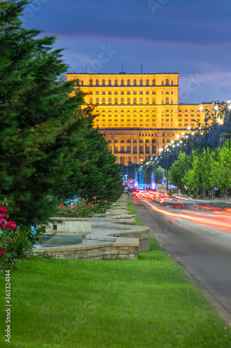 The Palace of the Parliament in Bucharest, Romania, by night. The second largest administrative building in the World. View from Unirii Boulevard. photo