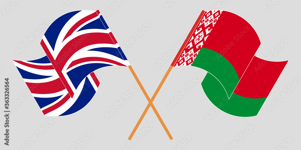Crossed and waving flags of Belarus and the UK