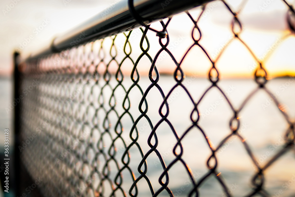 Chain link fencing - boundaries, divided, separation concept Chain link fencing - boundaries, divided, separation concept