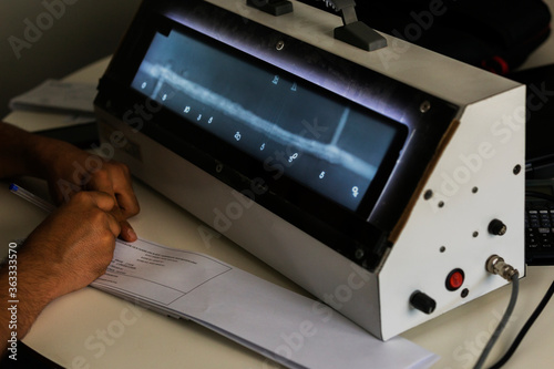 Принти на полотні The radiography film operator level 2 evaluation  radiographs of the welds with viewer and he is writing some reports