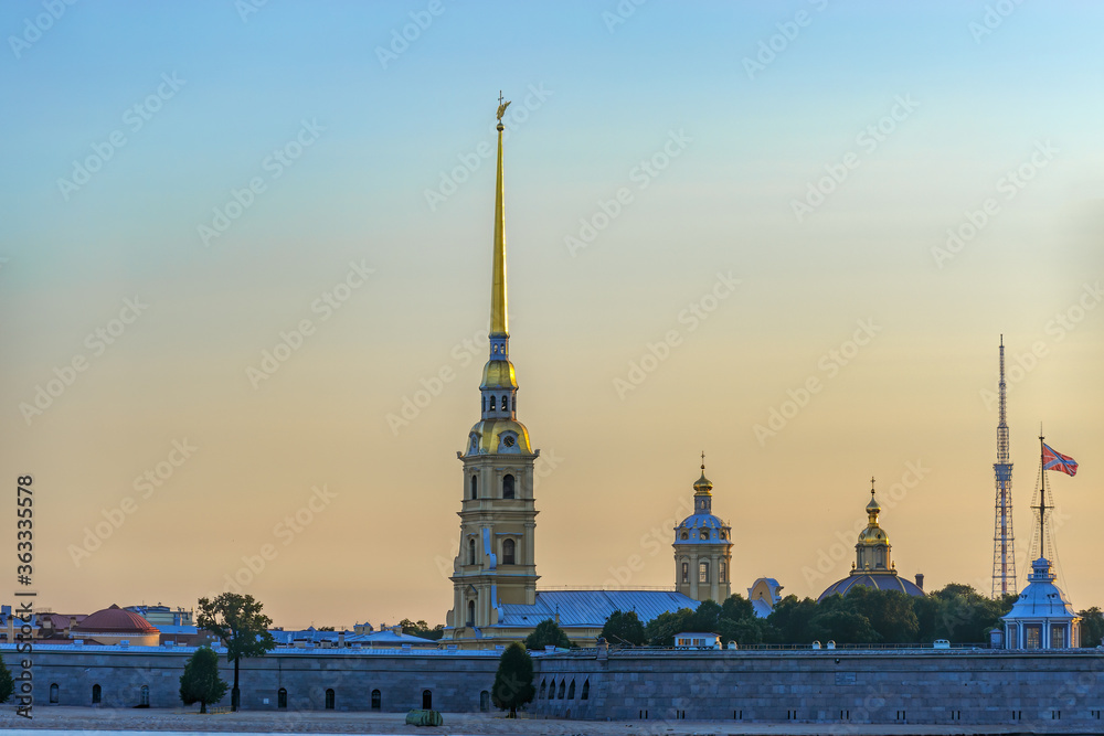 Sunrise view of Petropavlovskaya (Peter and Paul) fortress and orthodox Peter and Paul Cathedral on Zayachy Island after summer white night. Saint-Petersburg, Russia