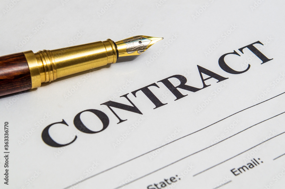 Contract formation elements a stylish pen and blank on office desk Contract formation elements a stylish pen and blank on office desk