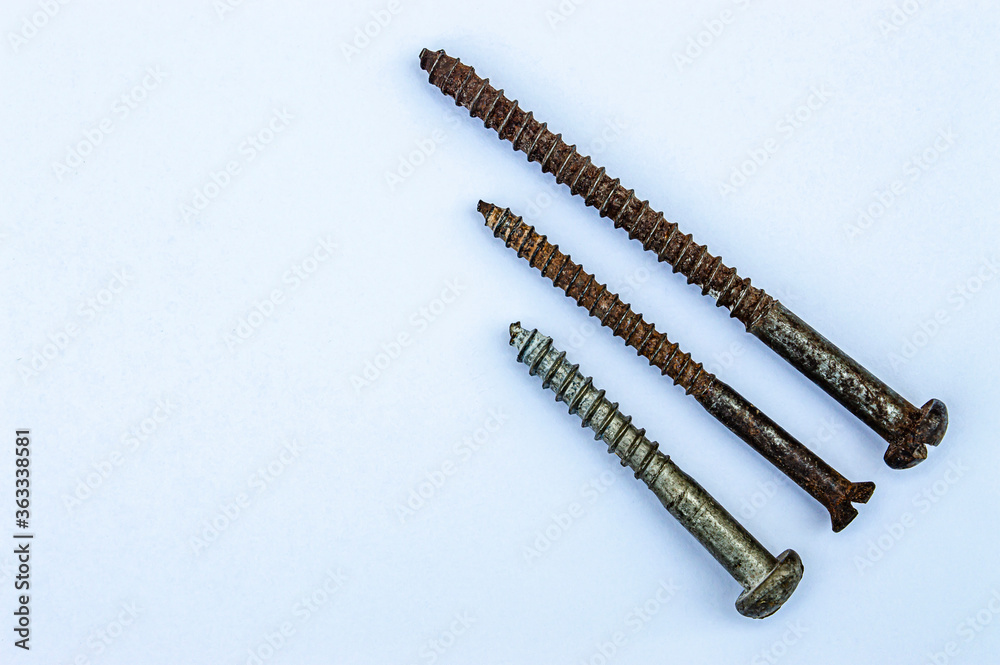 three old rusty iron screws isolate close up three old rusty iron screws isolate close up